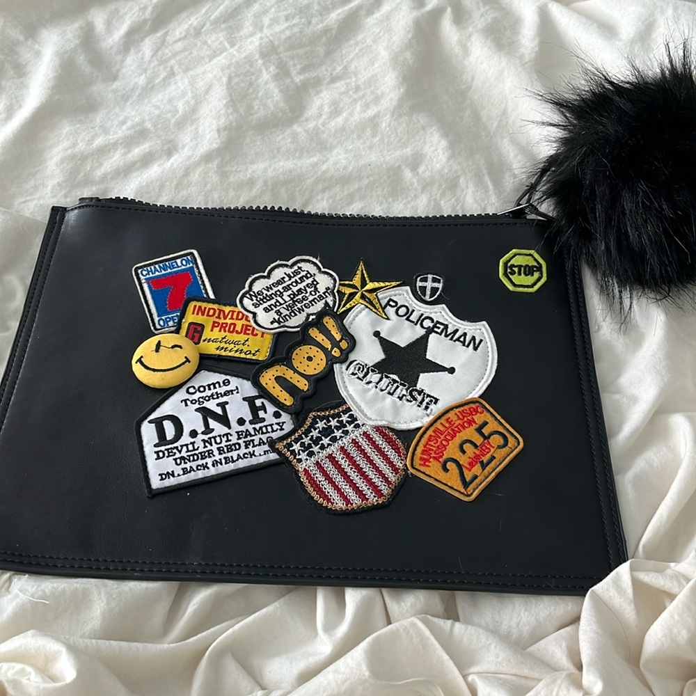 NWOT large black zipper bag with embroidered patches and big furry pom pom